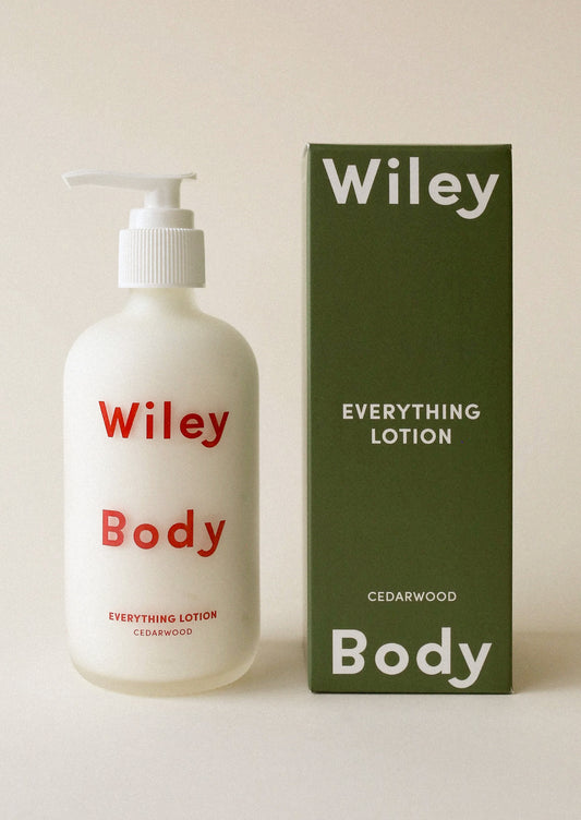 Wiley Body lotion bottle and packaging on a beige background
