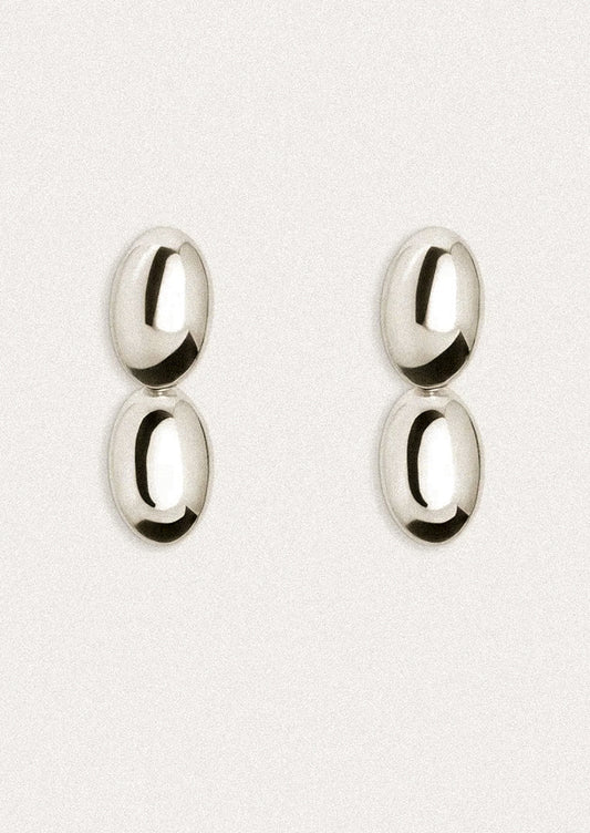Pair of silver earrings on a white background