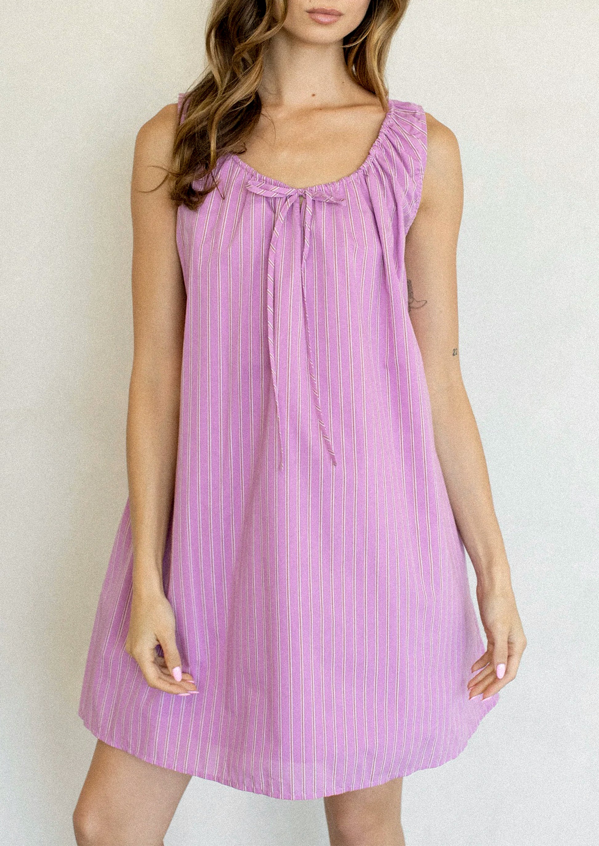pink purple striped dress Avrie Halter Maxi / Brown Stripe tie belted waist Flounce hemline Hem falls above the knee A Spring Diva Pink Striped Dress