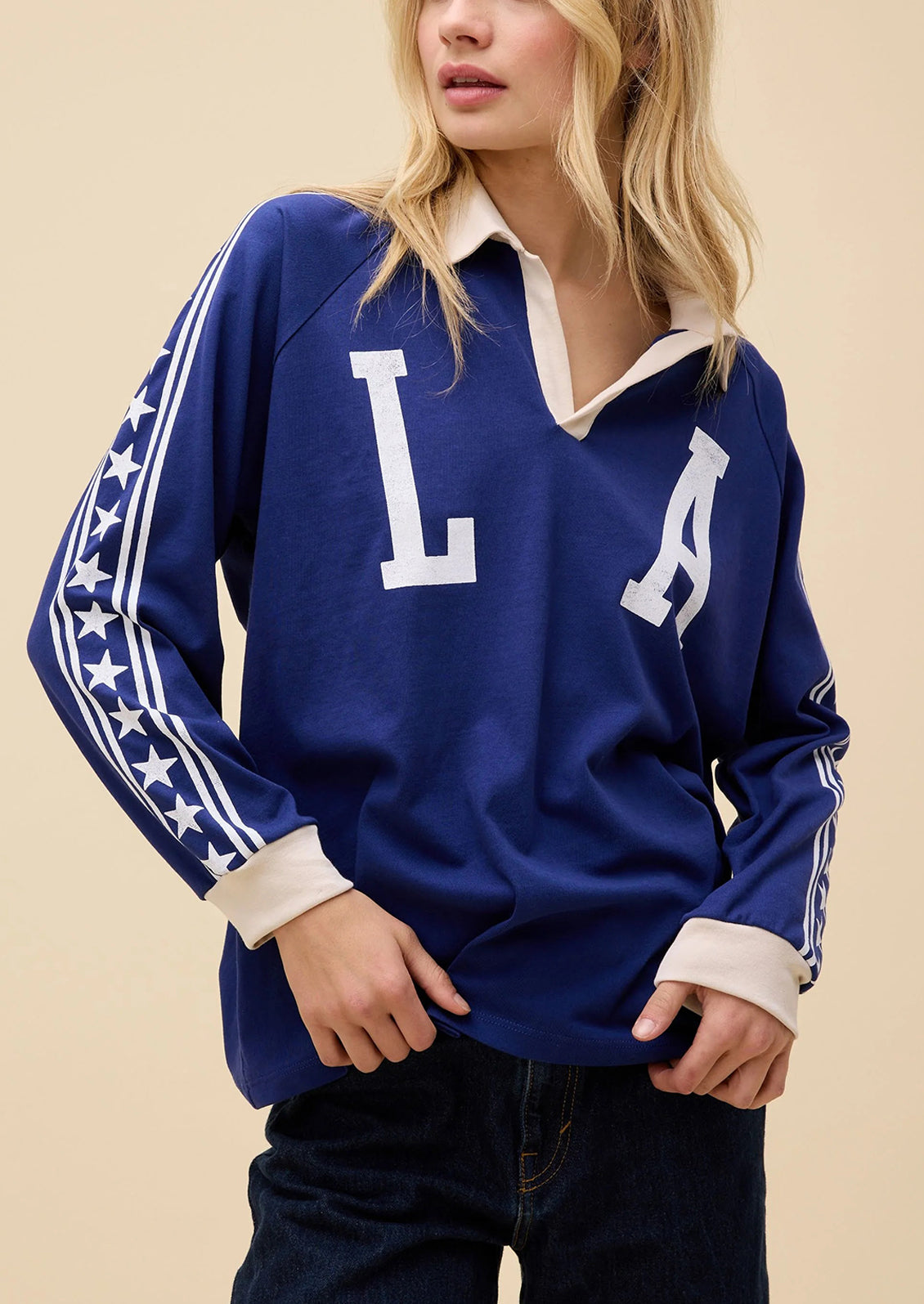 Blue sports jersey with 'L' and 'A' letters on a beige background