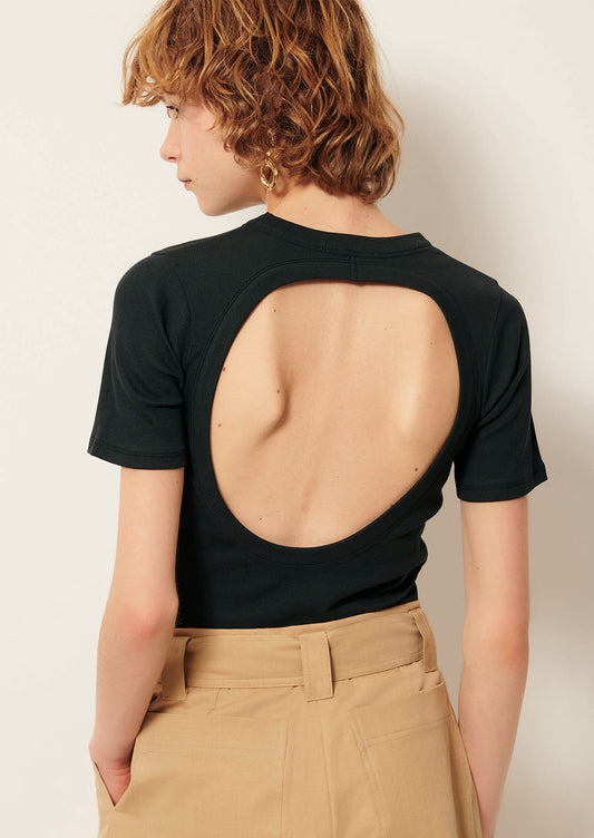 A person wearing a dark short sleeve t-shirt with large round back cutout.