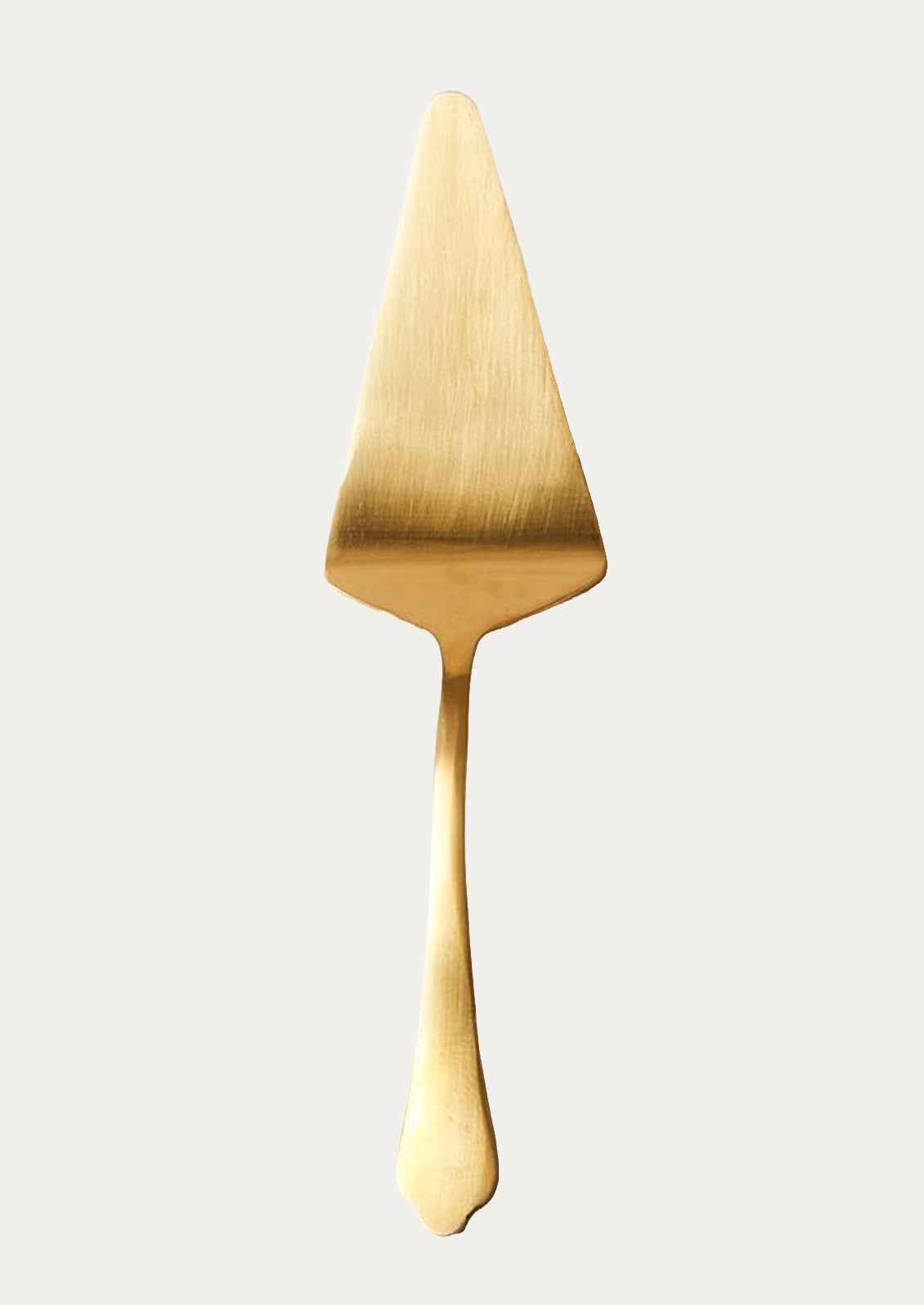 A stainless steel cake server in gold.