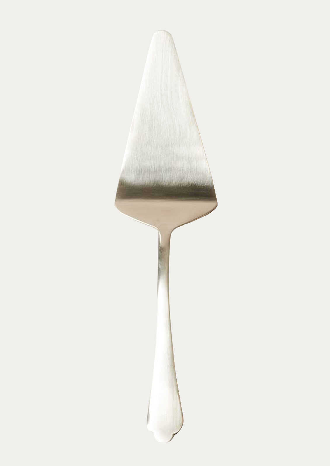 A stainless steel cake server in silver.