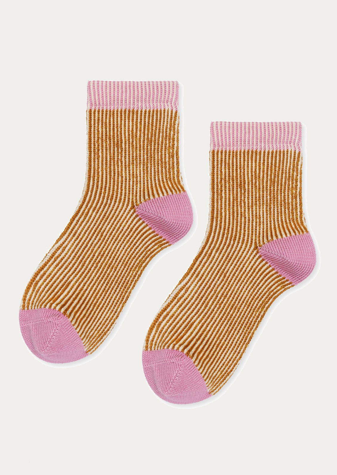 Pair of mustard yellow socks with pink accents on a white background