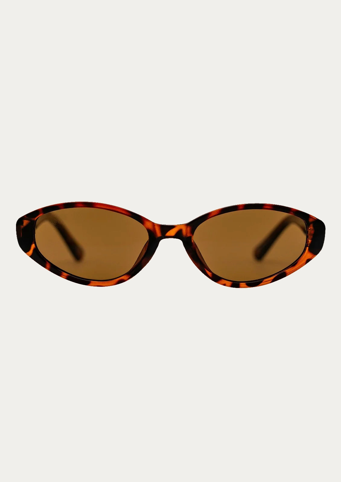 A pair of cat eye sunglasses with a tortoise frame and brown lenses.