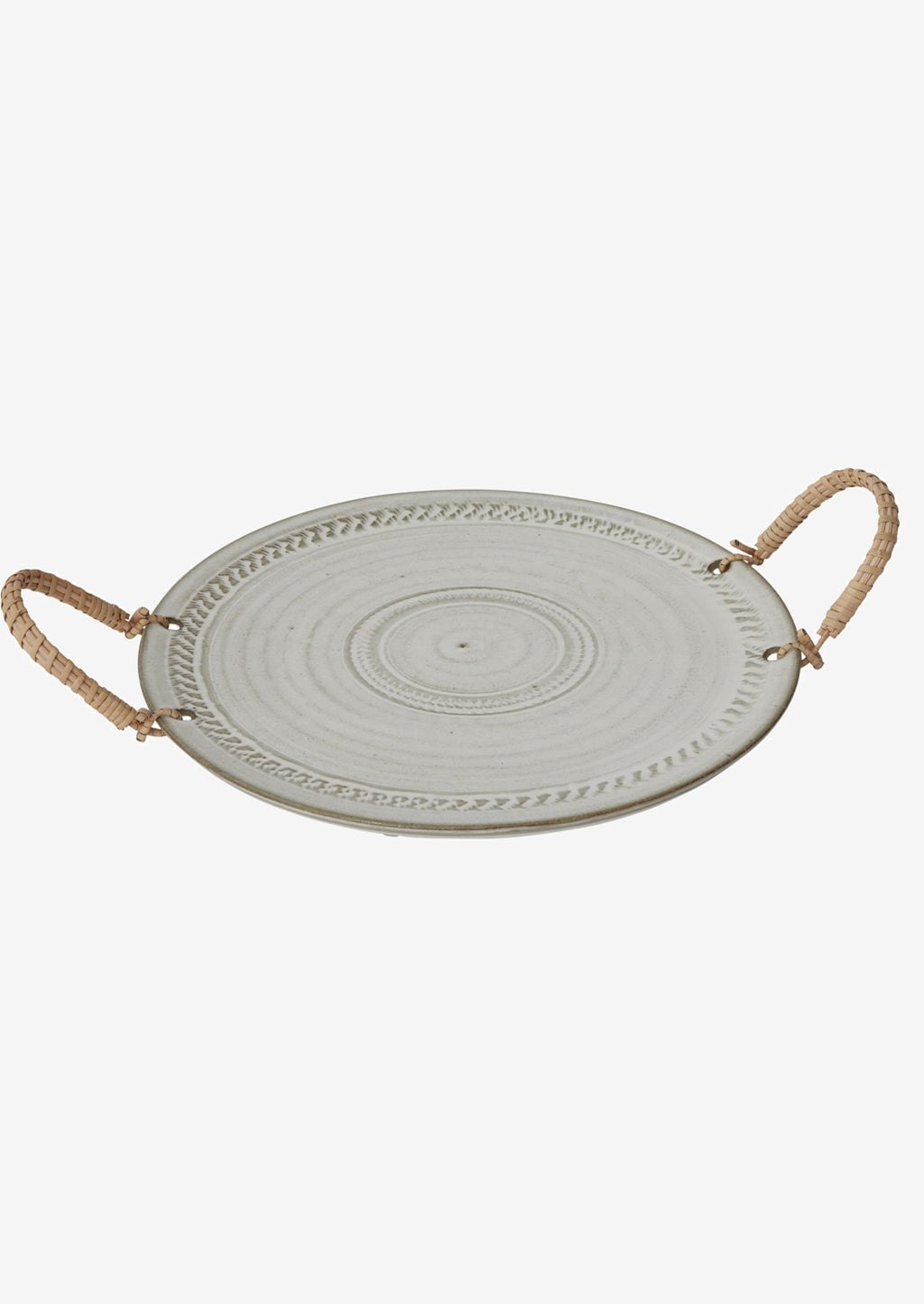 2: A round ceramic tray with neutral finish and rattan handles.