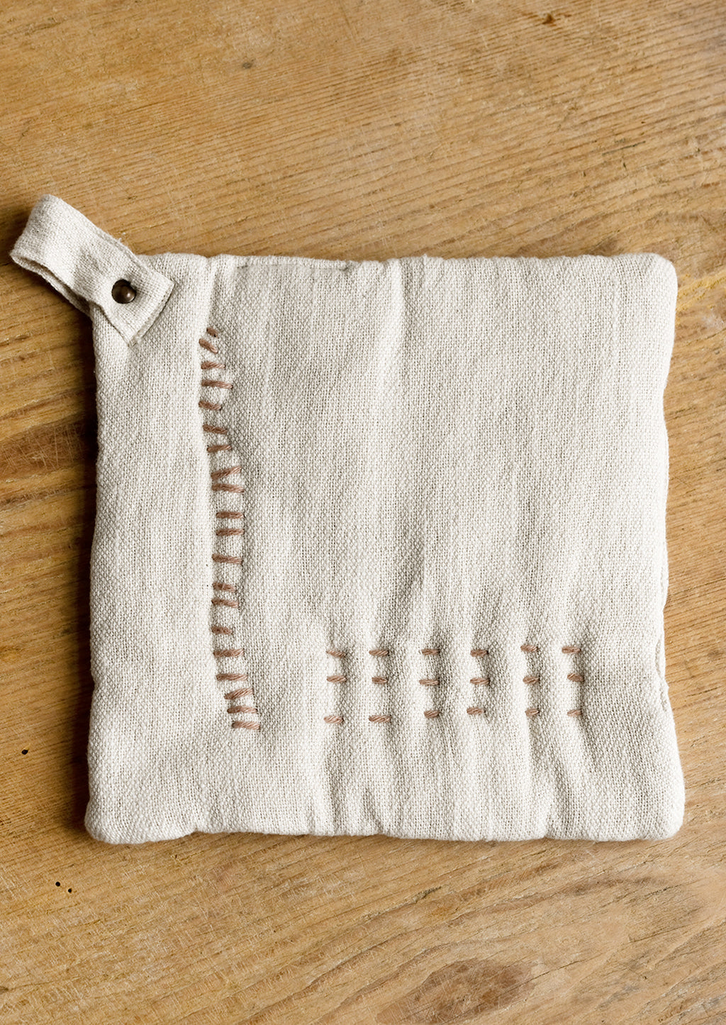 Natural: A cotton holder in ivory with decorative contrast stitching in clay.