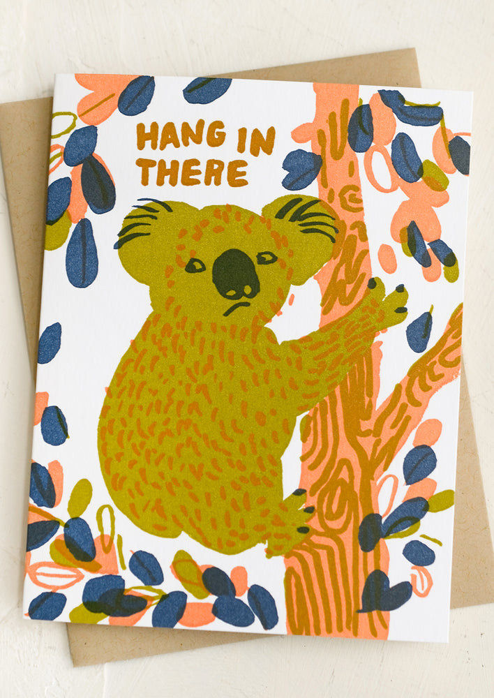 A koala printed greeting card reading "Hang in there".