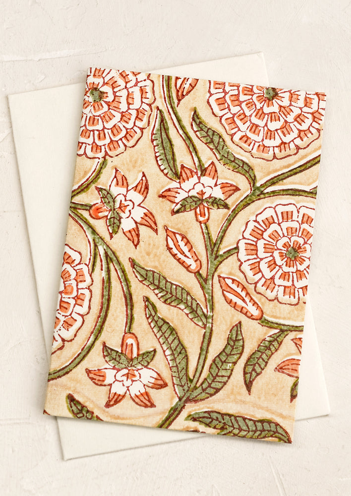 A block print card with peach floral.