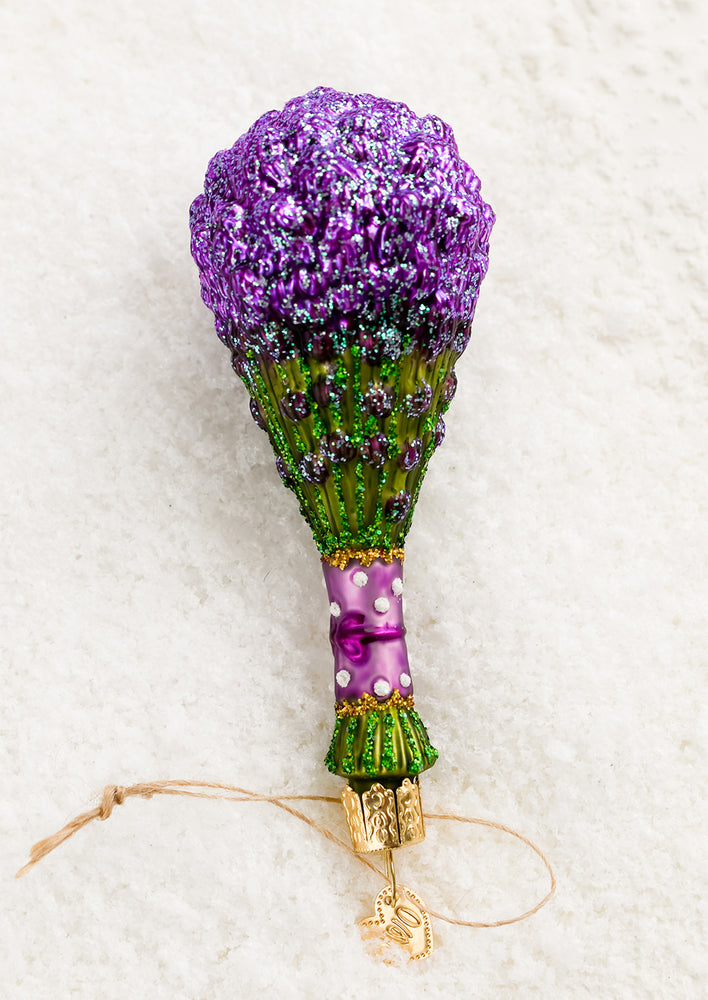 1: A glass holiday ornament of a bushel of lavender.