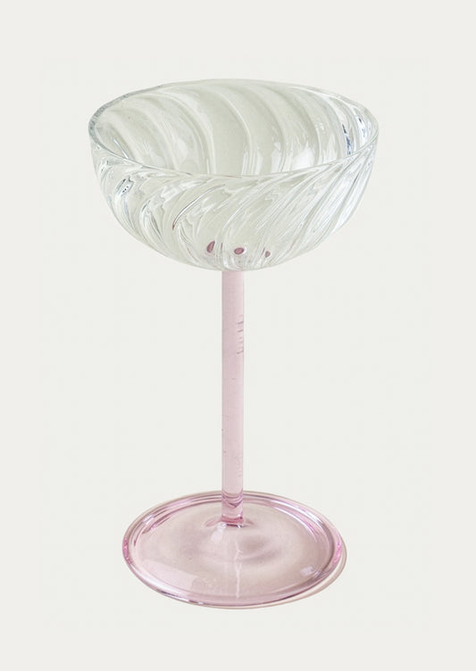 Clear glass with pink base on a white background