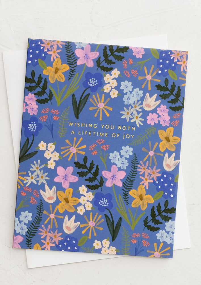 A blue floral print card reading "Wishing you both a lifetime of joy".