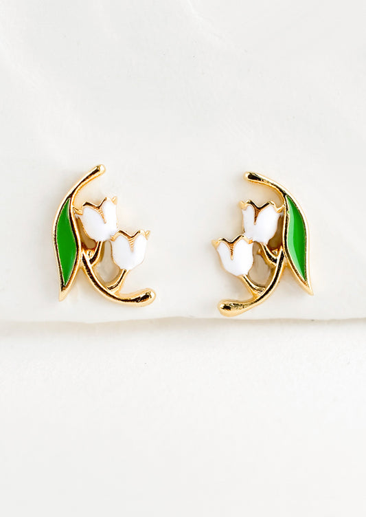 Small gold stud earrings in the shape of a lily of the valley flower, constructed in green and white enamel finish.