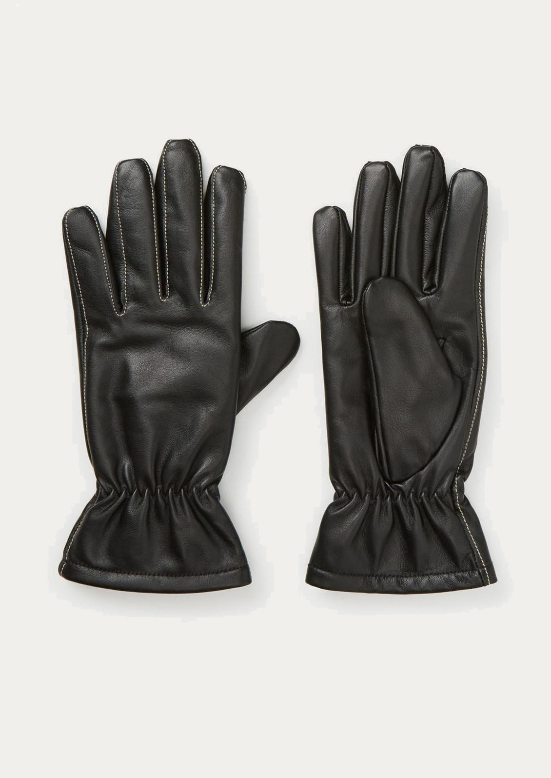 Pair of black leather gloves on a white background