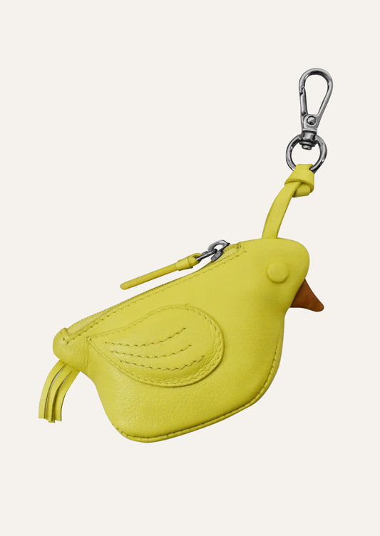 A small yellow leather pouch in the shape of a canary.