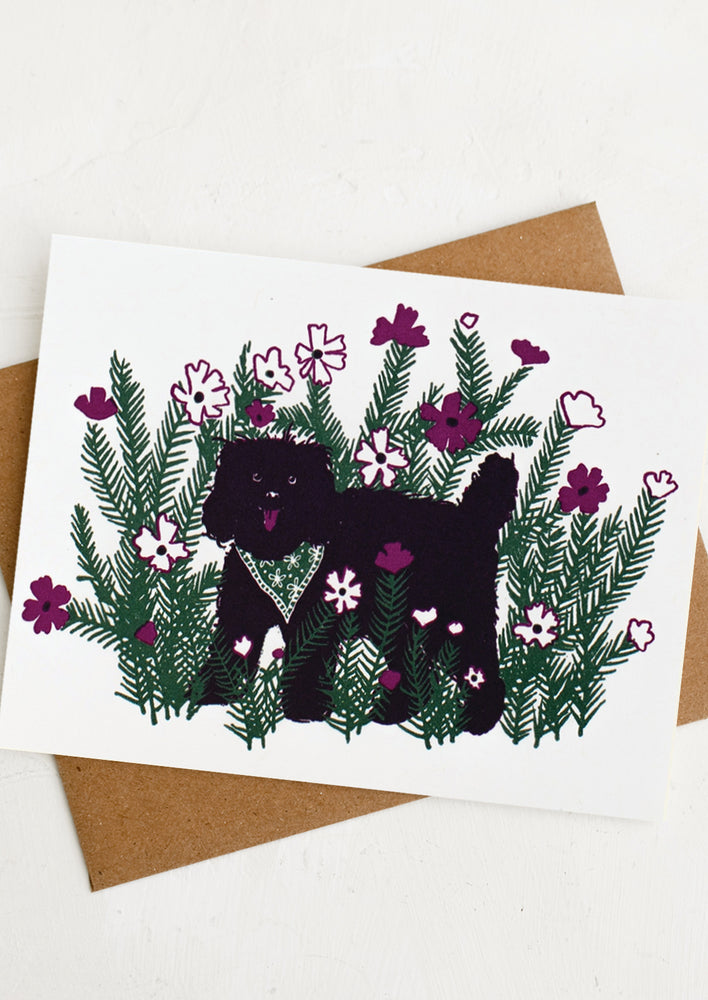 A textless card with illustration of a black dog in flowers.
