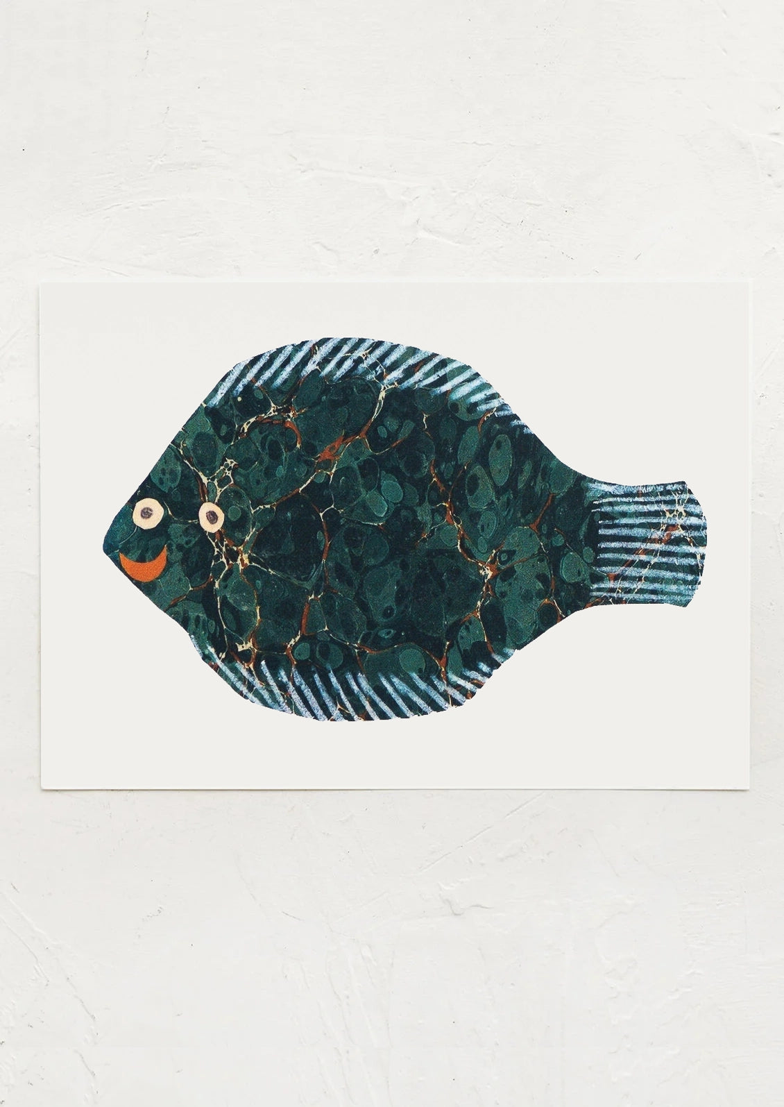 A small art print depicting a fish paper cutting.