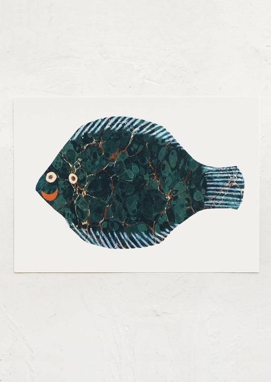 A small art print depicting a fish paper cutting.
