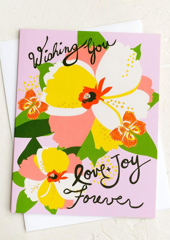 A floral print card reading "Wishing you love and joy forever".