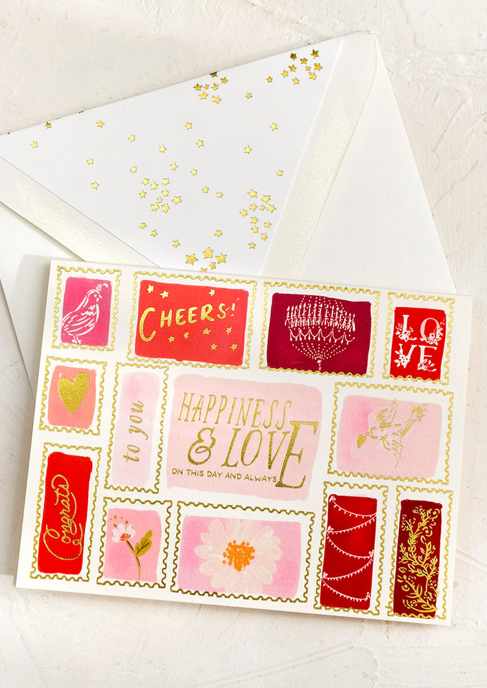 A card with illustration of red and pink stamps reading "LOVE".