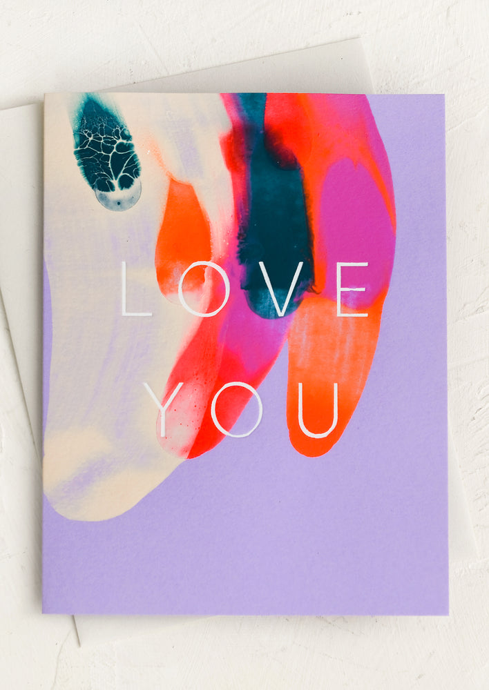 A hand painted card with swirl pattern and large "LOVE YOU" white text.