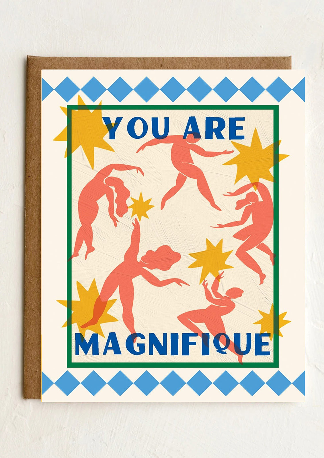 Card with colorful design of women and stars with text 'YOU ARE MAGNIFIQUE' on a white background
