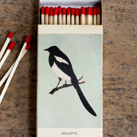 1: A swallow and magpie bird printed matchbox with red-tipped long matches.