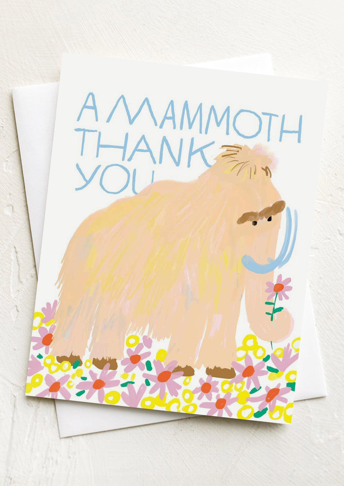 A greeting card with illustration of a mammoth, text above reads "A Mammoth thank you".