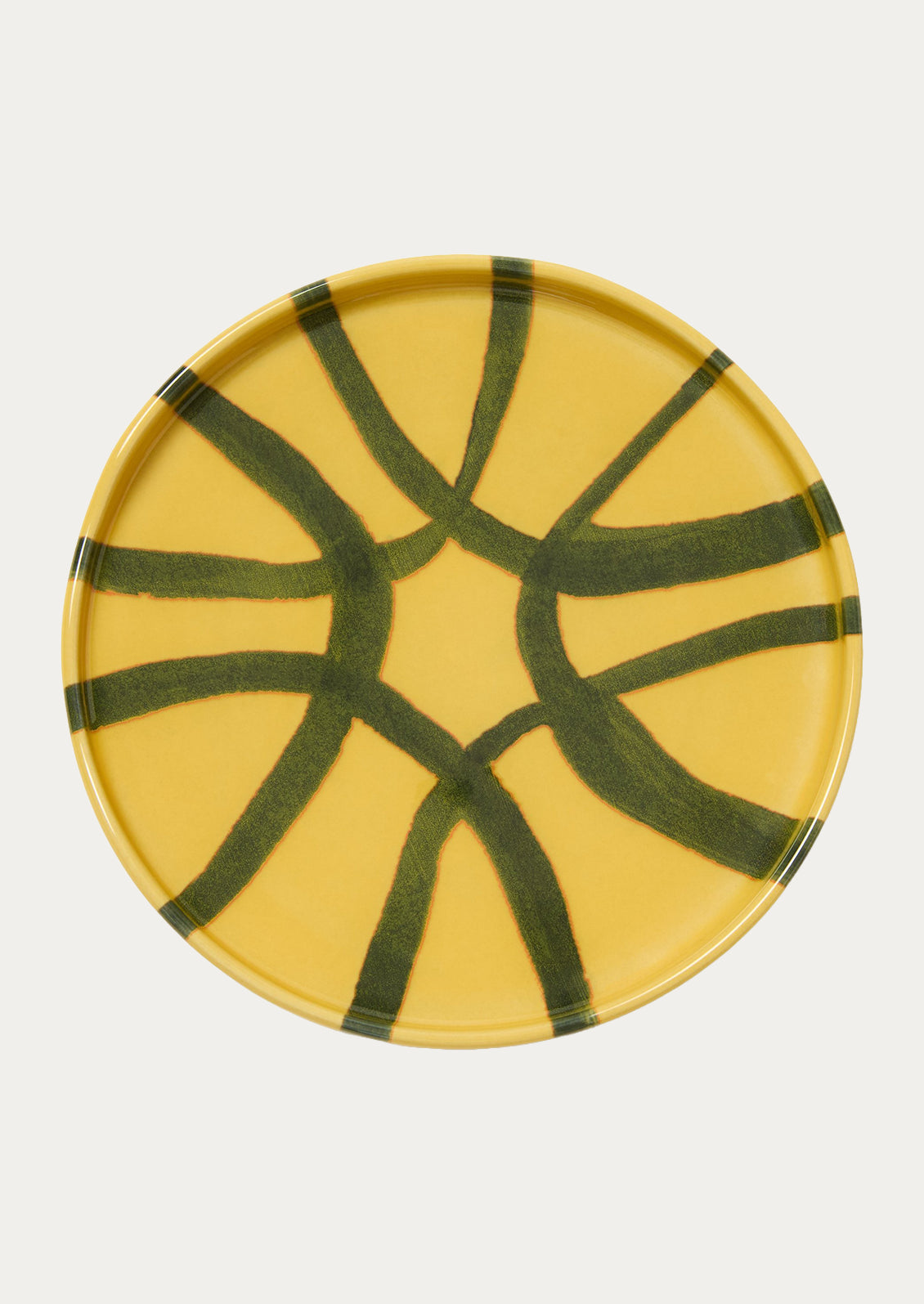 A ceramic side plate wth an abstract design in a marigold yellow color.