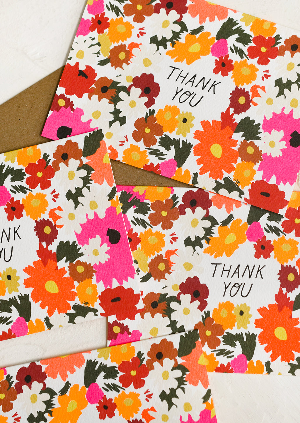 1: A set of neon daisy print thank you cards.