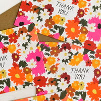 1: A set of neon daisy print thank you cards.