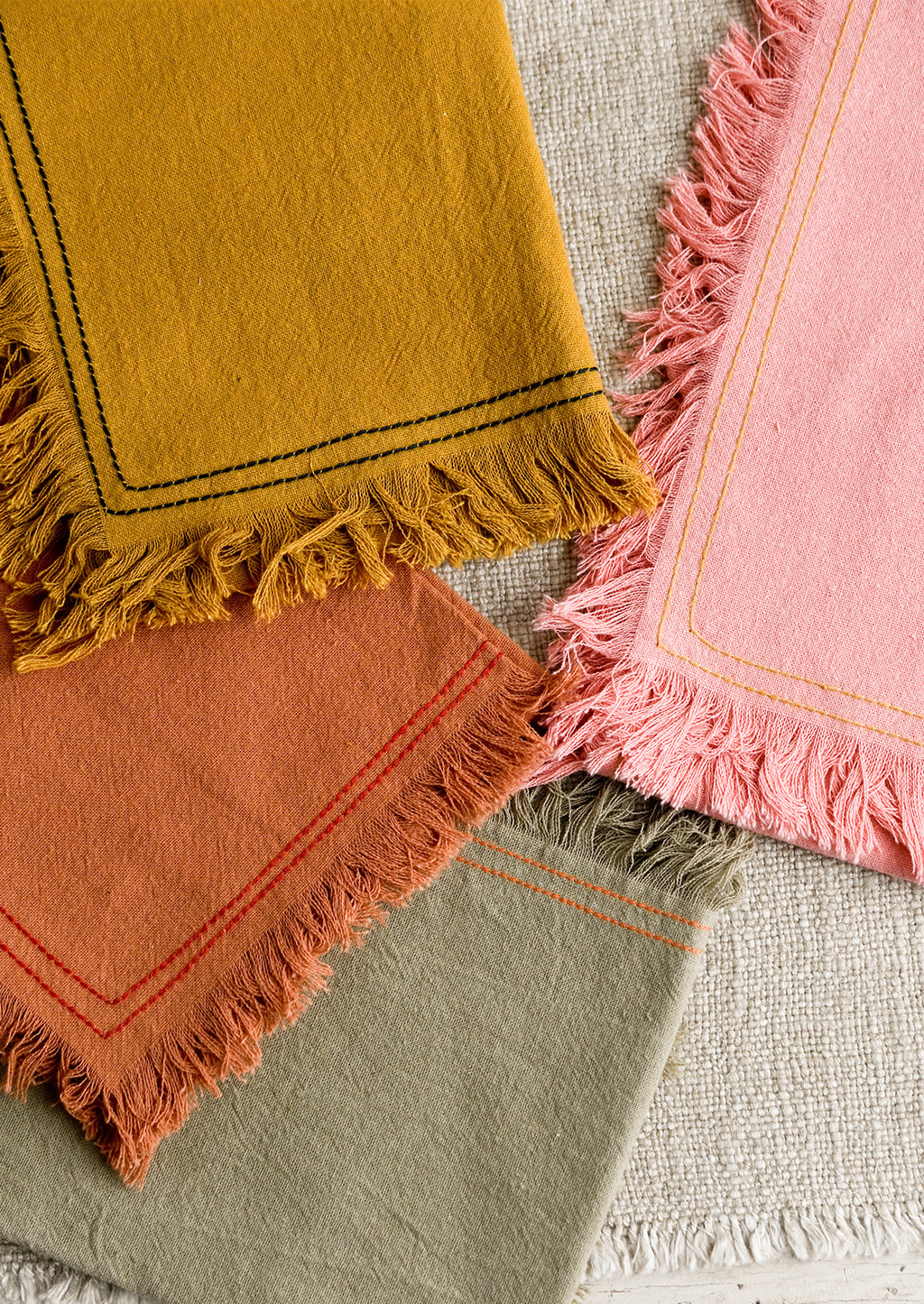 1: Assorted colors of cotton tea towel with contrast stitchings.