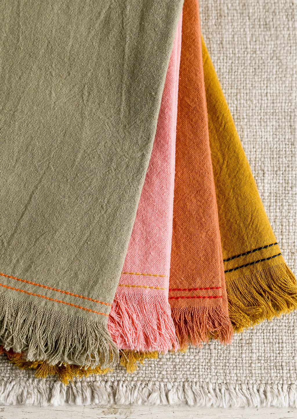 3: Assorted colors of cotton tea towel with contrast stitchings.