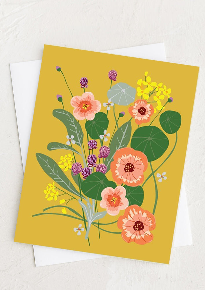 An illustrated floral print greeting card with mustard background.