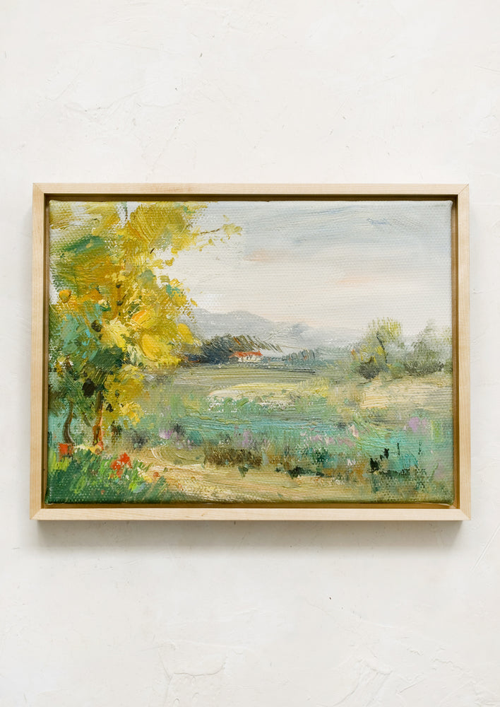 A framed original oil painting of colorful meadow.