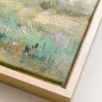 2: A framed original oil painting of colorful meadow, in natural wood frame.