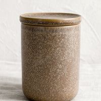 Pebble: Stoneware jars in shades of brown, with lid.