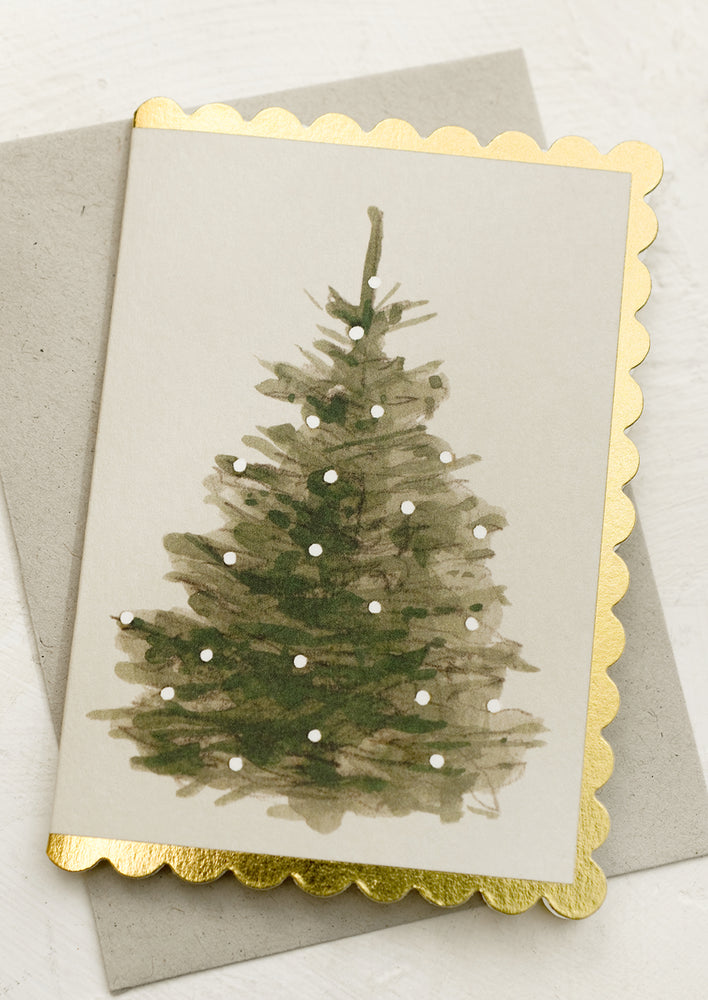 A mini scalloped edge card with tree design.
