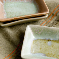 2: Rectangular ceramic sauce dishes in turquoise, green and brown varied glazes.