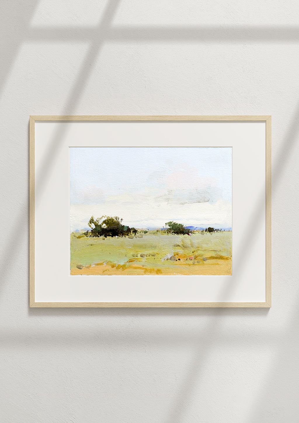 2: A framed landscape oil painting.