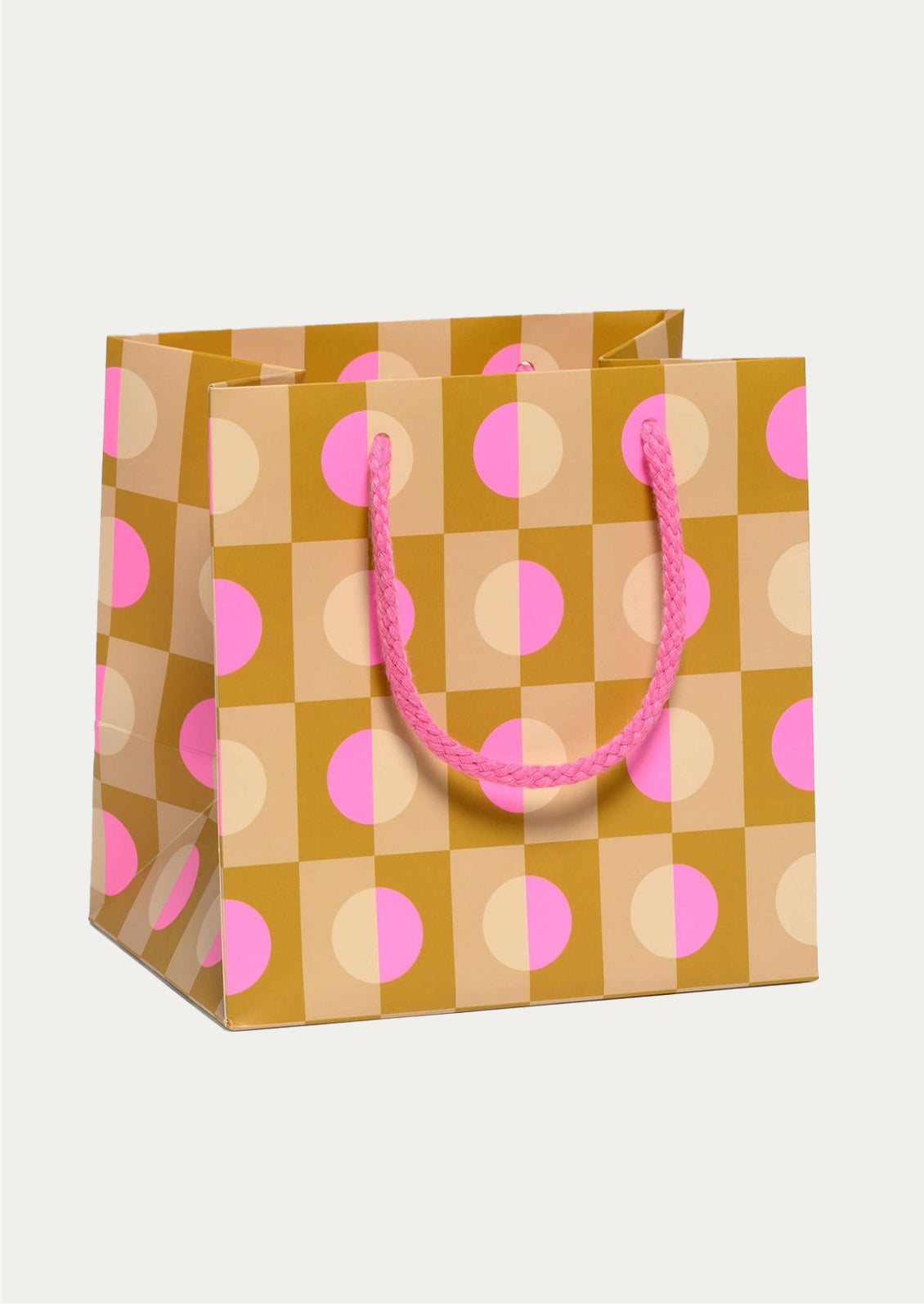 Gift bag with pink circle pattern on a white background