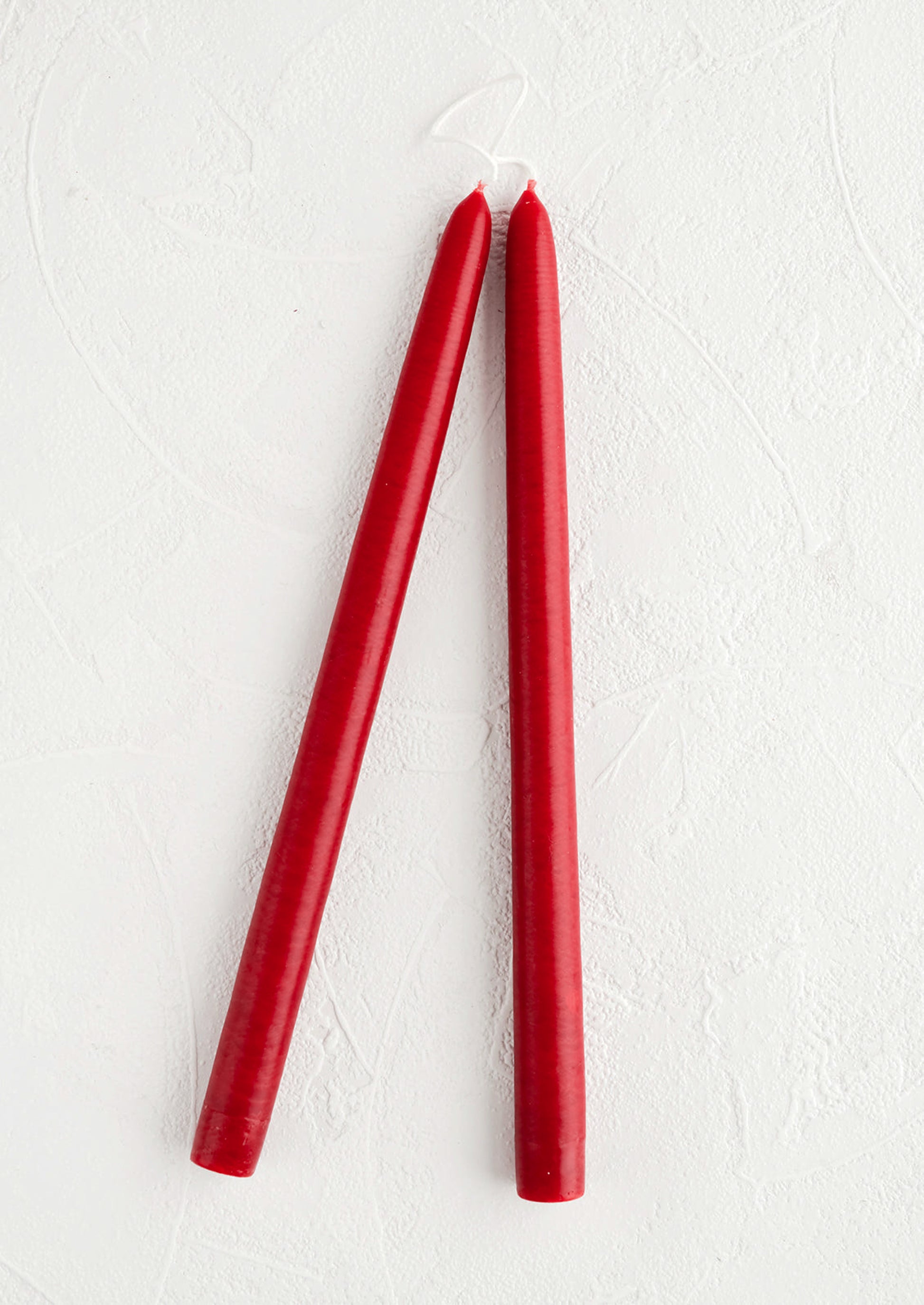 Pair of taper candles in cherry red