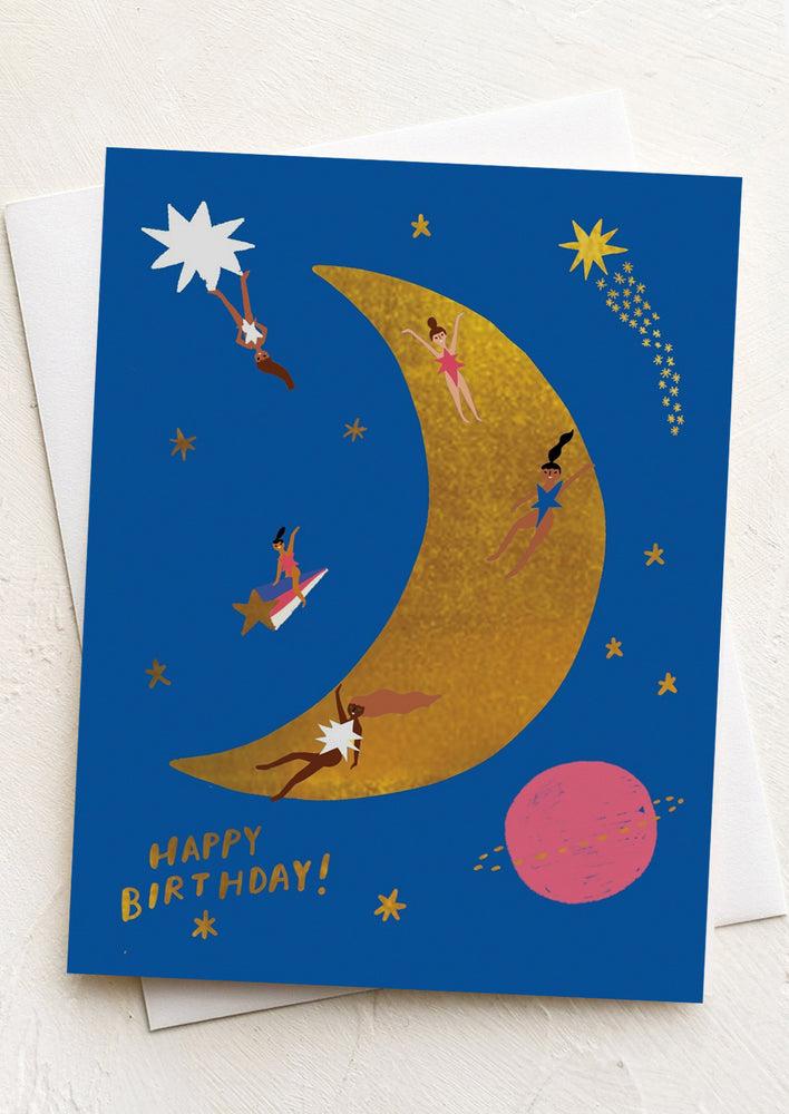 A birthday card with image of women on the moon.