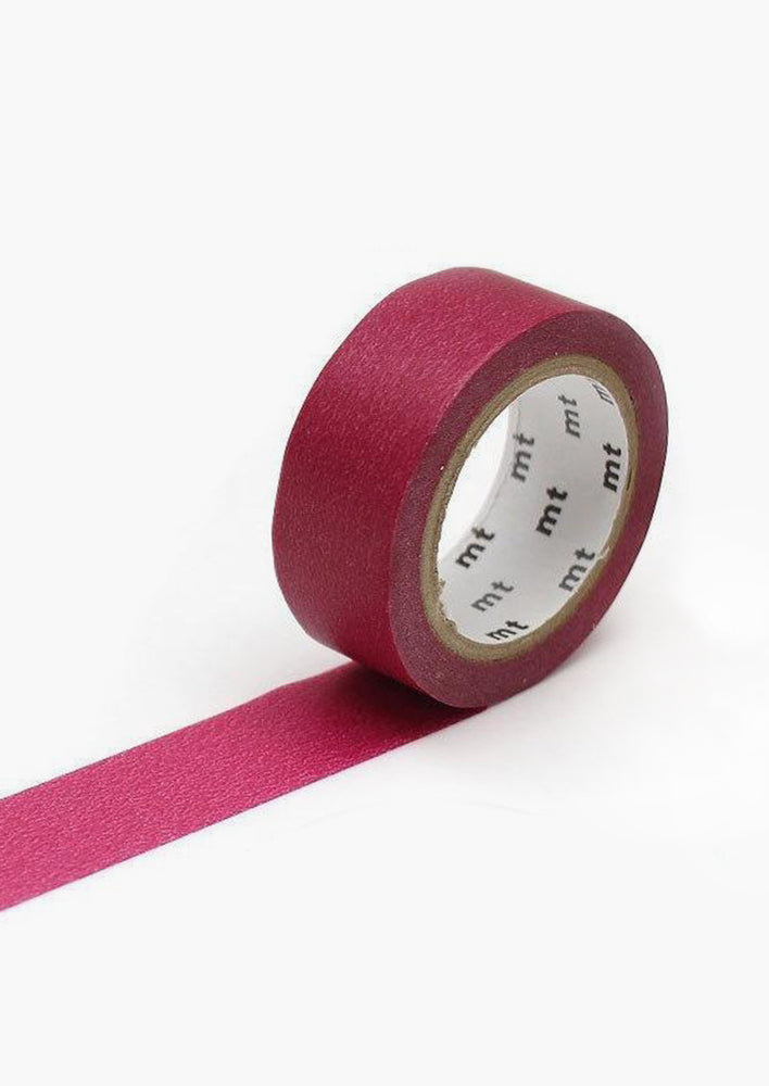 A roll of washi tape in solid fig color.