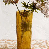 2: An amber glass vase with irregular texture and shape.
