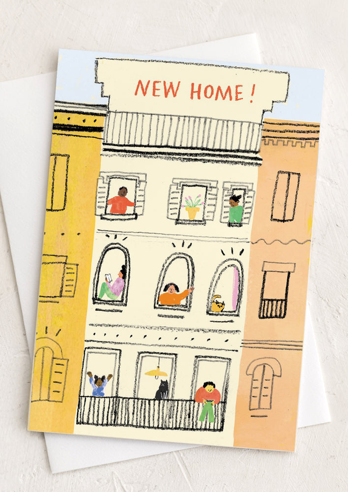 An illustrated greeting card reading "New Home!".
