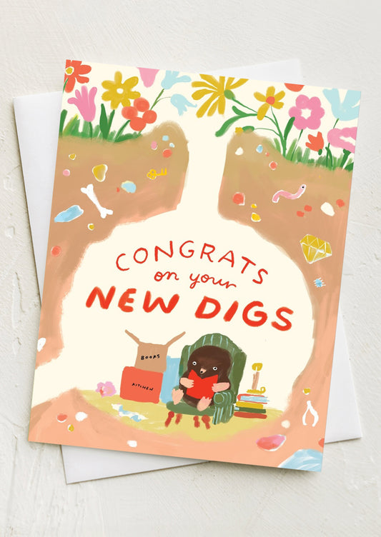 A card with image of badger in hole, text reads "Congrats on your new digs".