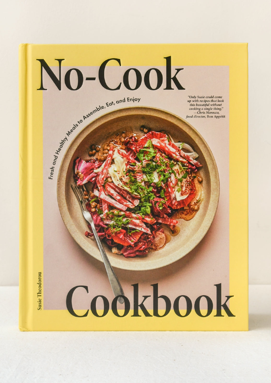 A book titled "No-Cook Cookbook" by Susie Theodorou.