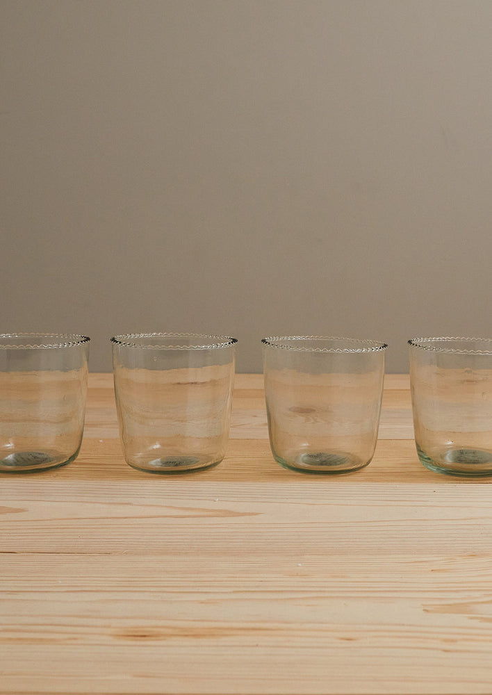 Drinking glasses with small ruffle edge.