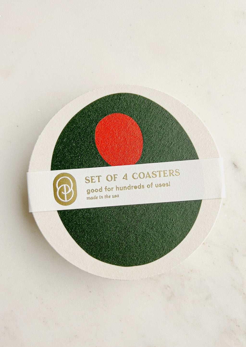 Pimento Olive: A set of paper coasters in pimento olive print.